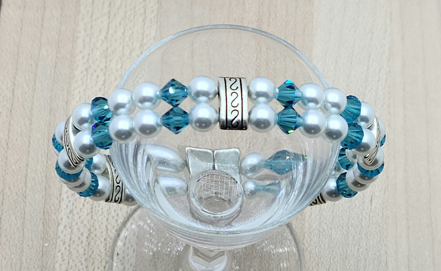 Soft & SO pretty define this double row bracelet of pale moonlight crystal pearls & light teal crystals. The fancy dividers are lead & nickel free alloy.
Neodymium magnetic clasp - these are awesome . . . & VERY strong!