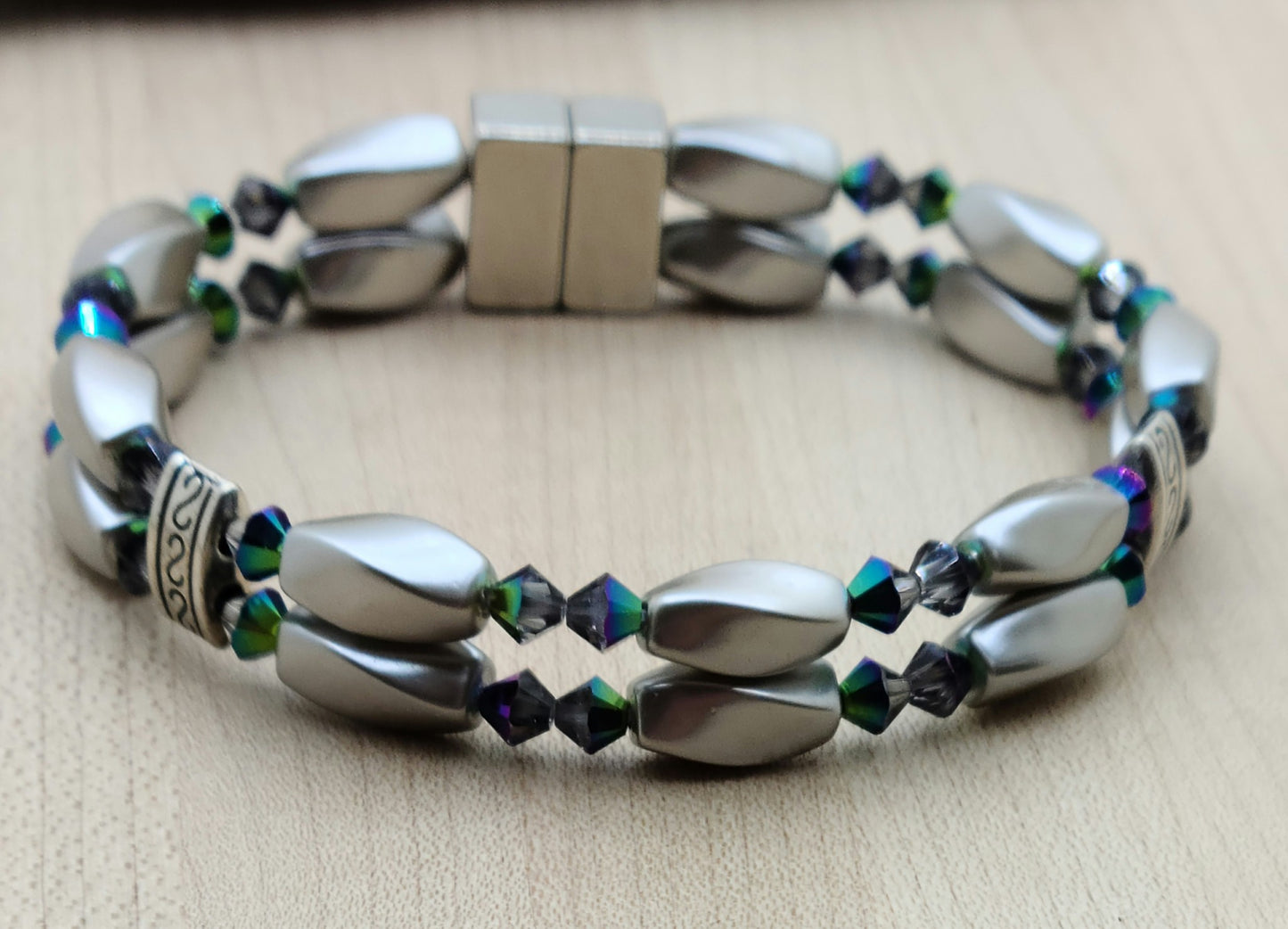 The metallic, almost iridescent greens, blues, & purples of the scarab beetle come to life in the fascinating crystals of the magnetic hematite bracelet. The fancy dividers are lead & nickel free alloy.
Neodymium magnetic clasp - these are awesome . . . & VERY strong!