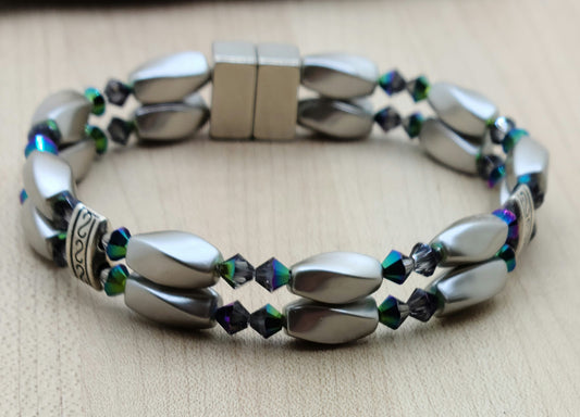 The metallic, almost iridescent greens, blues, & purples of the scarab beetle come to life in the fascinating crystals of the magnetic hematite bracelet. The fancy dividers are lead & nickel free alloy.
Neodymium magnetic clasp - these are awesome . . . & VERY strong!