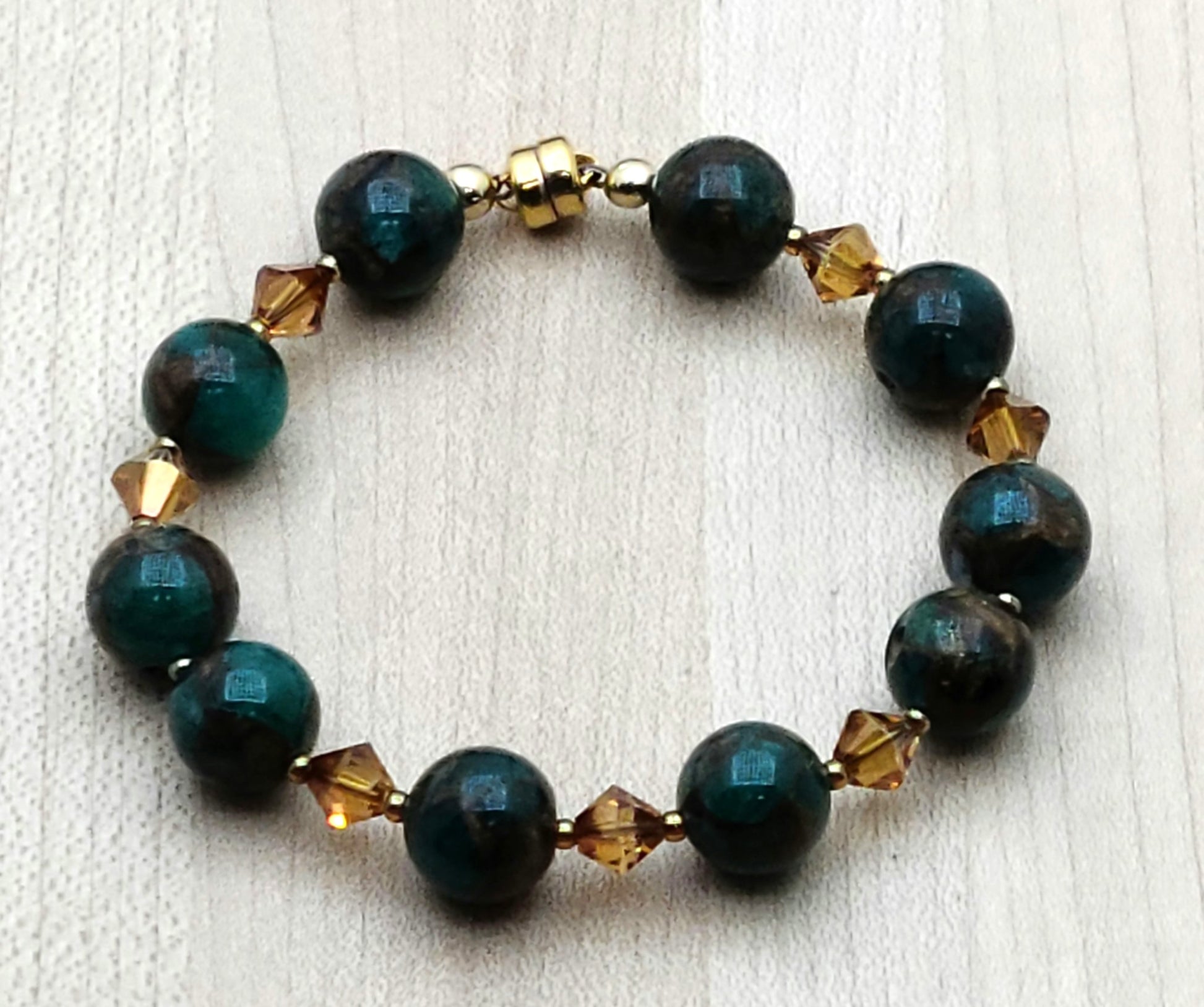 Green & bronze composite stones go great with copper crystals in this bracelet for those who love all things green! Neodymium magnetic clasp - these are awesome.