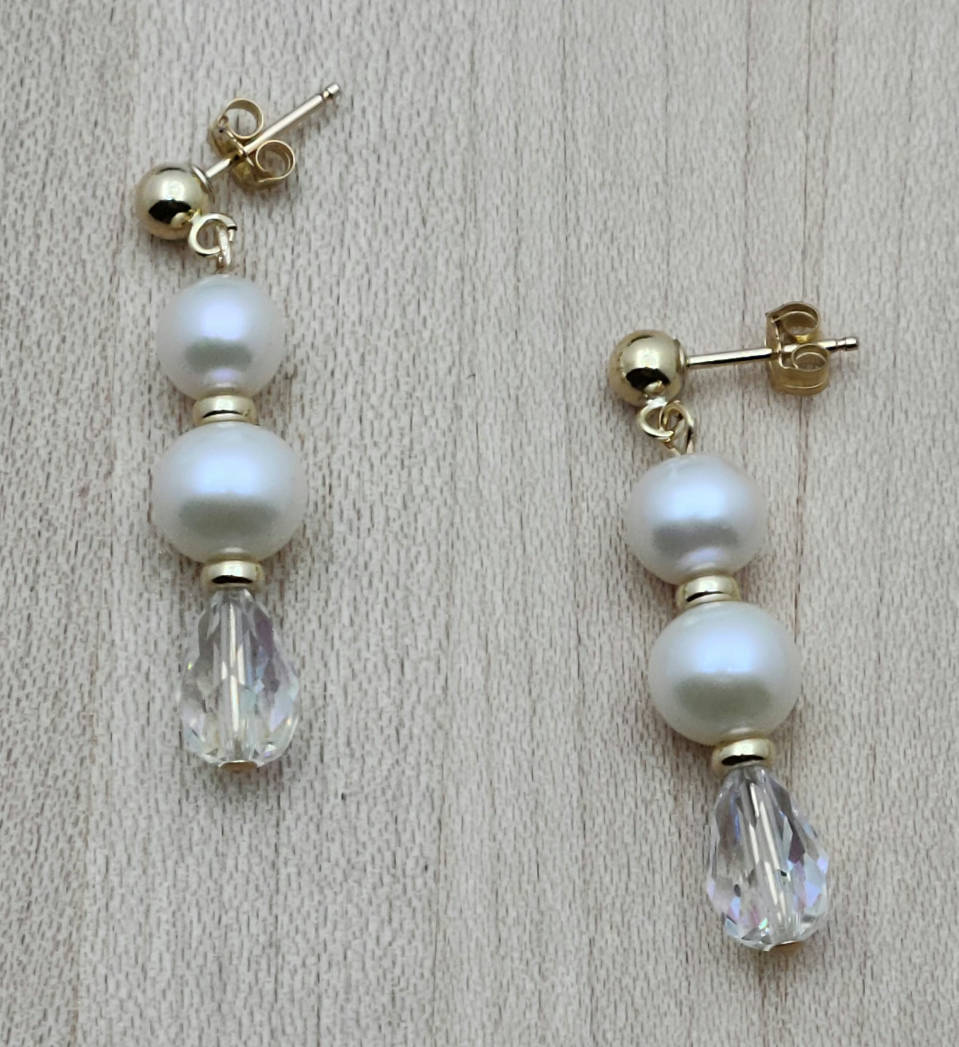 Freshwater pearls are SO classy. You'll love the movement & sparkle of this pair that joins pearls, gold fill , aur 1 3/8" with gold ball post earrings