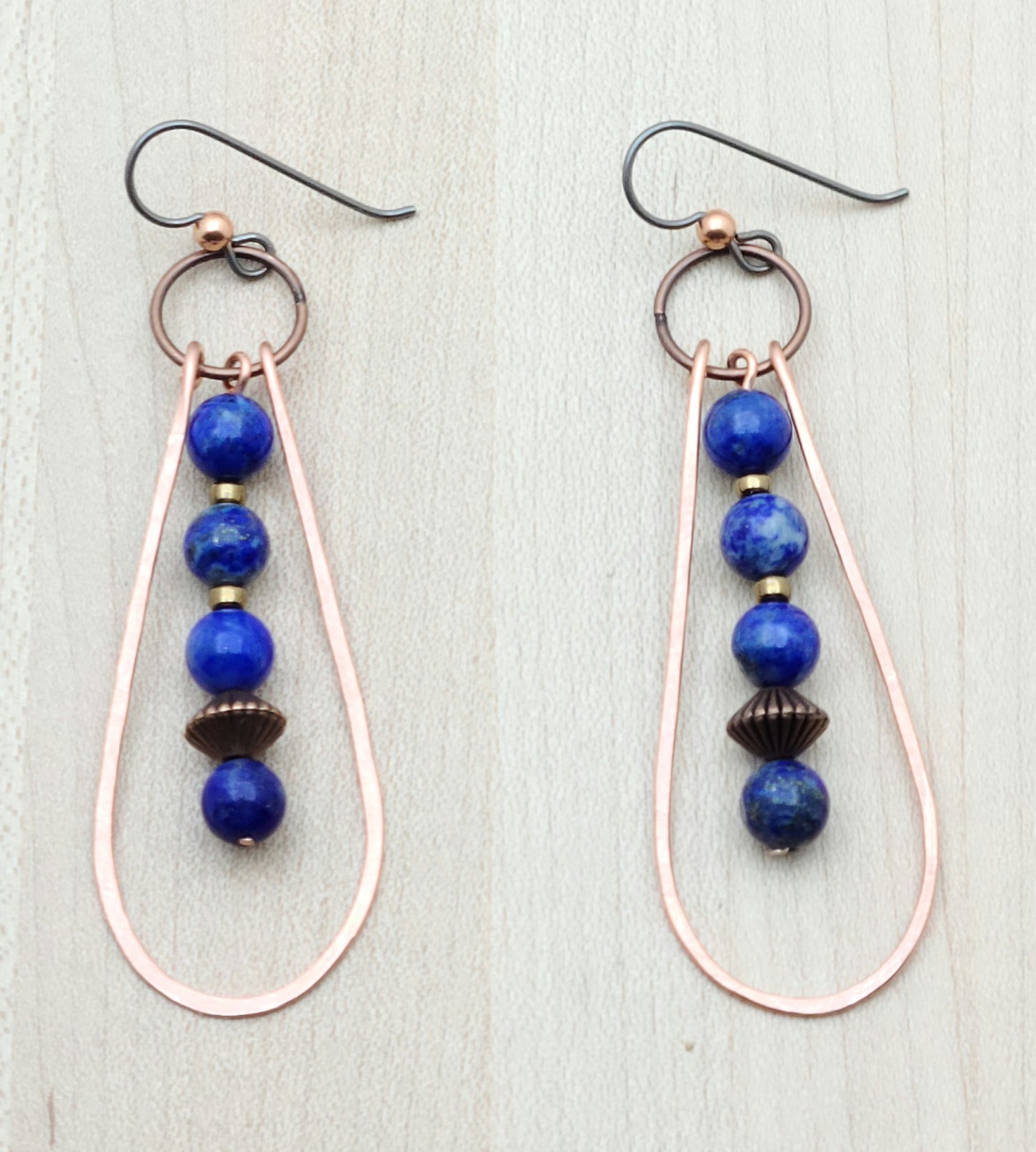 Fun &amp; casual pair up in these hammered copper & lapis lazuli earrings! 3" with niobium (considered hypoallergenic) fish hook ear wires.