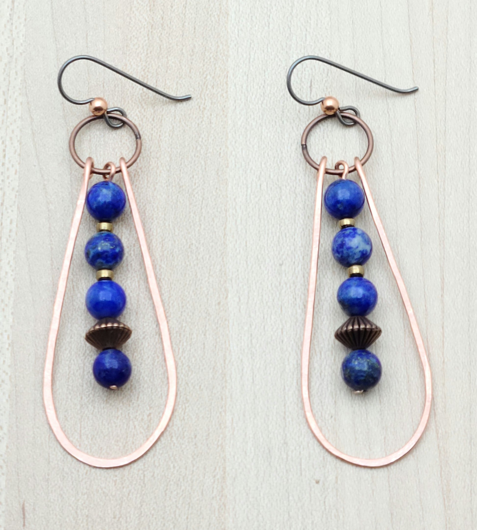 Fun &amp; casual pair up in these hammered copper & lapis lazuli earrings! 3" with niobium (considered hypoallergenic) fish hook ear wires.