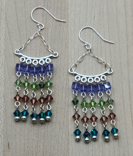 Movement, color, & sparkle will define your ears with these crystal chandelier beauties! 2 5/8" with sterling silver fish hook ear wires.