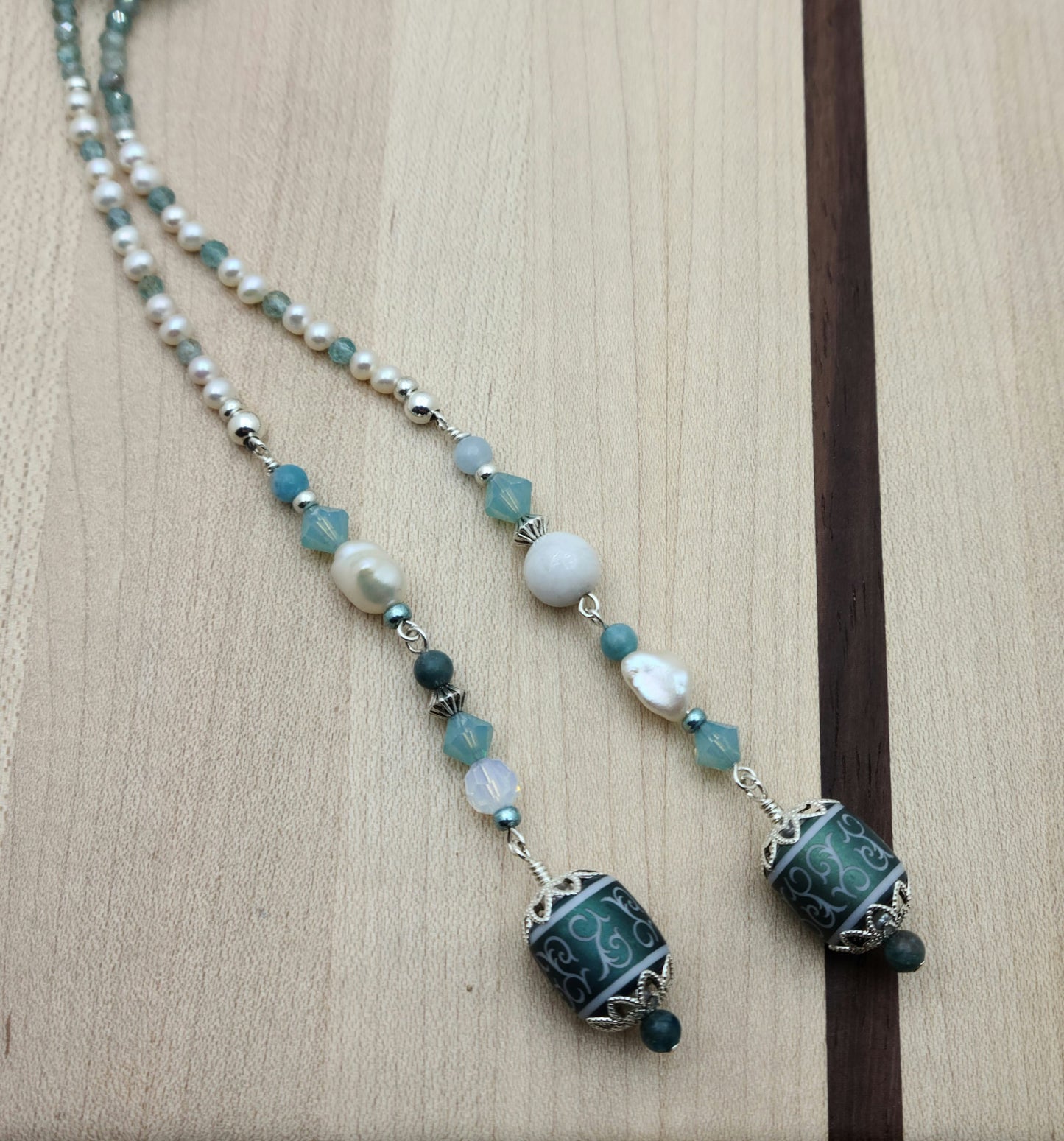 Be your own stylist with this versatile lariat necklace of tiny, light reflecting faceted aqua apatite beads & featuring lovely etched crystal focals.
You have apatite, crystals*, Miyuki (the best brand) seed beads, FW pearls, aquamarine, &amp; white crazy lace. SO much to see in 57"!