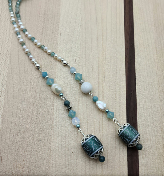 Be your own stylist with this versatile lariat necklace of tiny, light reflecting faceted aqua apatite beads & featuring lovely etched crystal focals.
You have apatite, crystals*, Miyuki (the best brand) seed beads, FW pearls, aquamarine, &amp; white crazy lace. SO much to see in 57"!