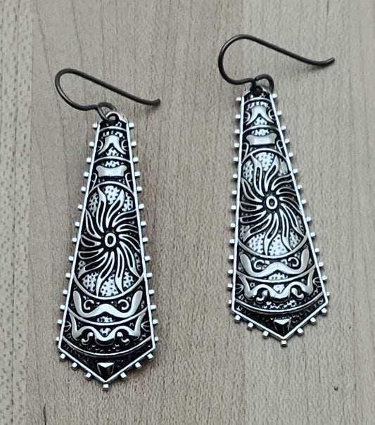 These stamped, lead-free pewter earrings have interesting geometric designs and are extremely lightweight. A lot of bang without the weight!