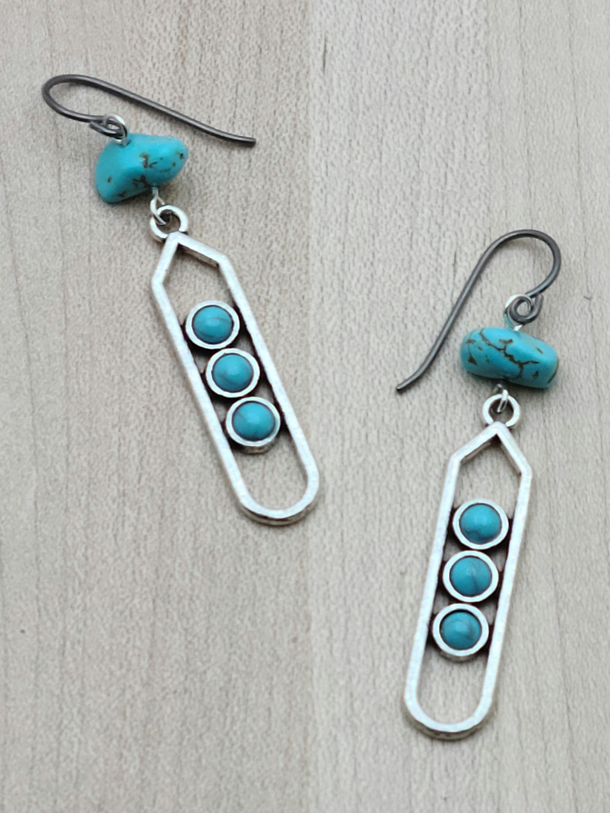 These lead-free pewter column earrings are adorned with turquoise howlite and are extremely lightweight. A great look without the weight!