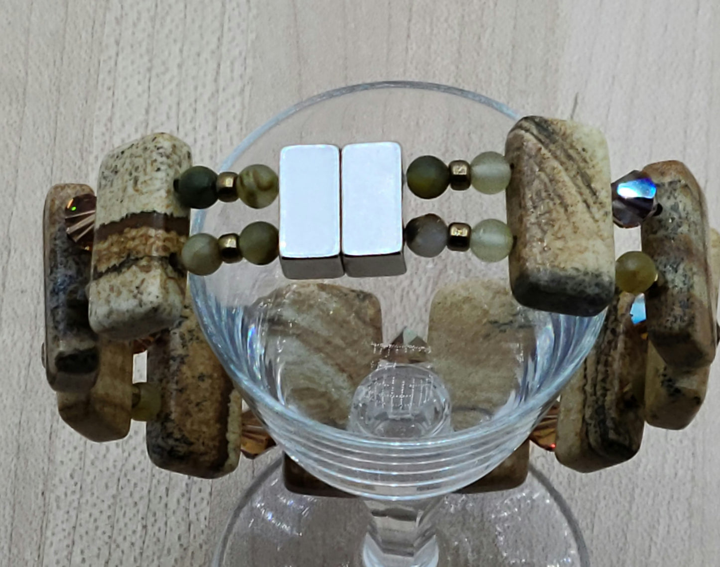 Picture jasper is such an interesting stone! The stones are double drilled and separated by smokey topaz crystals & golden pietersite.  With a strong magnetic clasp.