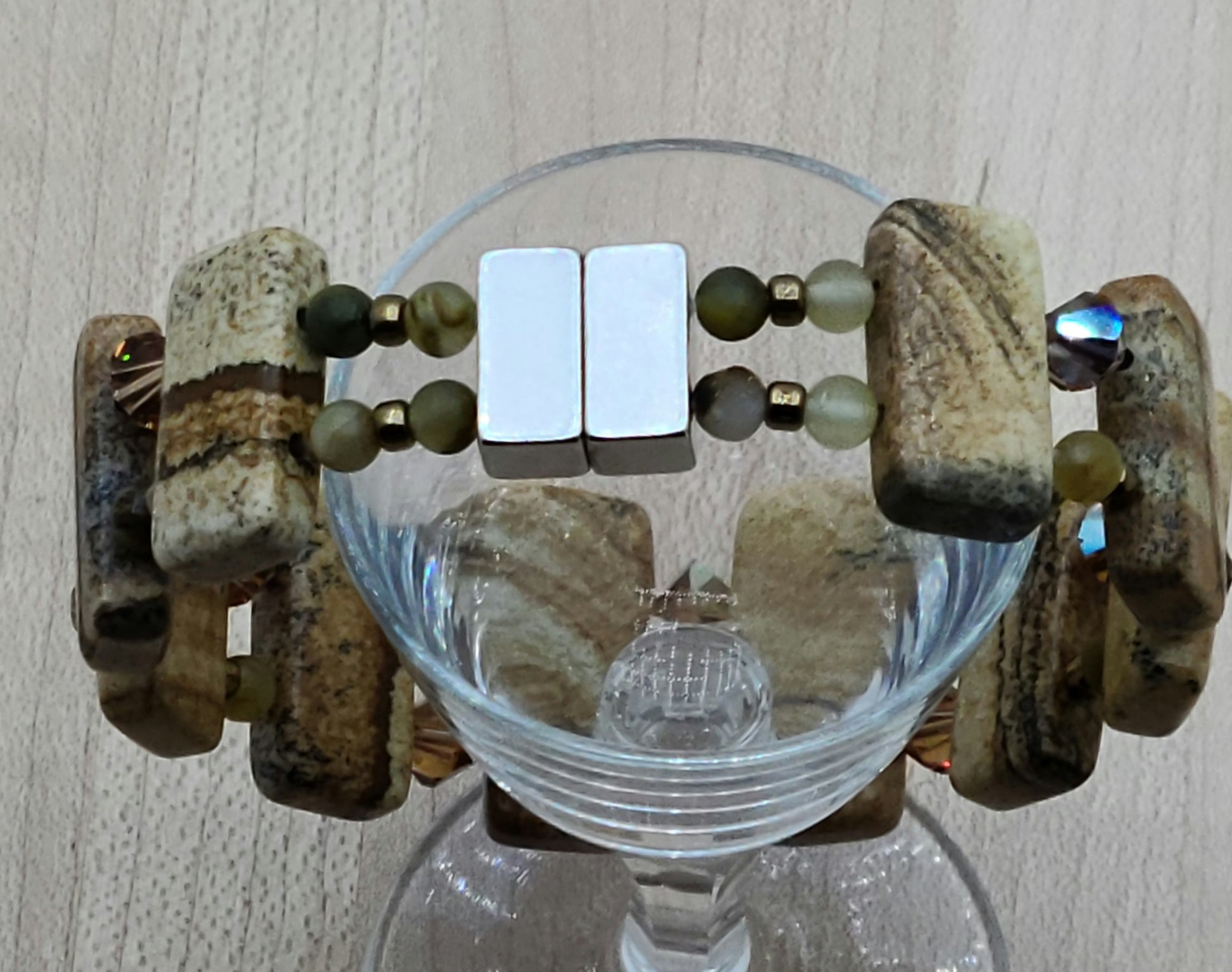 Picture jasper is such an interesting stone! The stones are double drilled and separated by smokey topaz crystals & golden pietersite.  With a strong magnetic clasp.