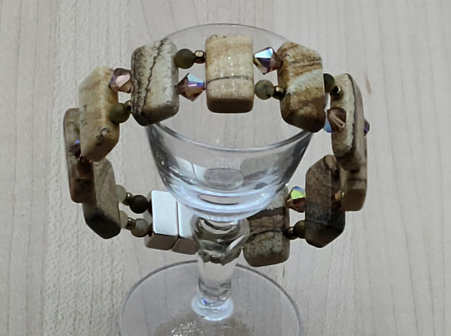 Picture jasper is such an interesting stone! The stones are double drilled and separated by smokey topaz crystals & golden pietersite.  With a strong magnetic clasp.