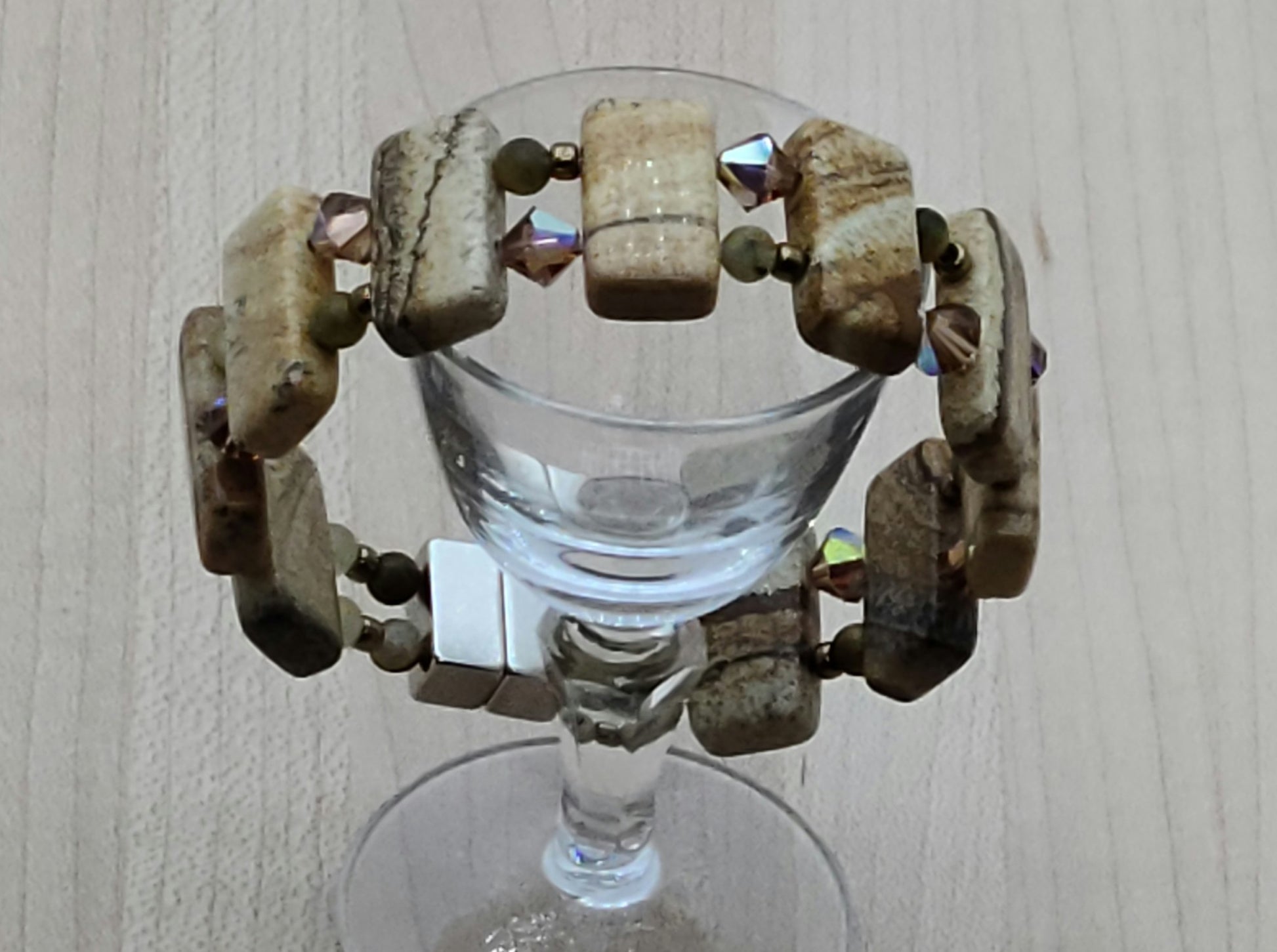 Picture jasper is such an interesting stone! The stones are double drilled and separated by smokey topaz crystals & golden pietersite.  With a strong magnetic clasp.