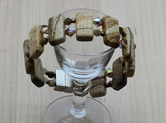 Picture jasper is such an interesting stone! The stones are double drilled and separated by smokey topaz crystals & golden pietersite.  With a strong magnetic clasp.