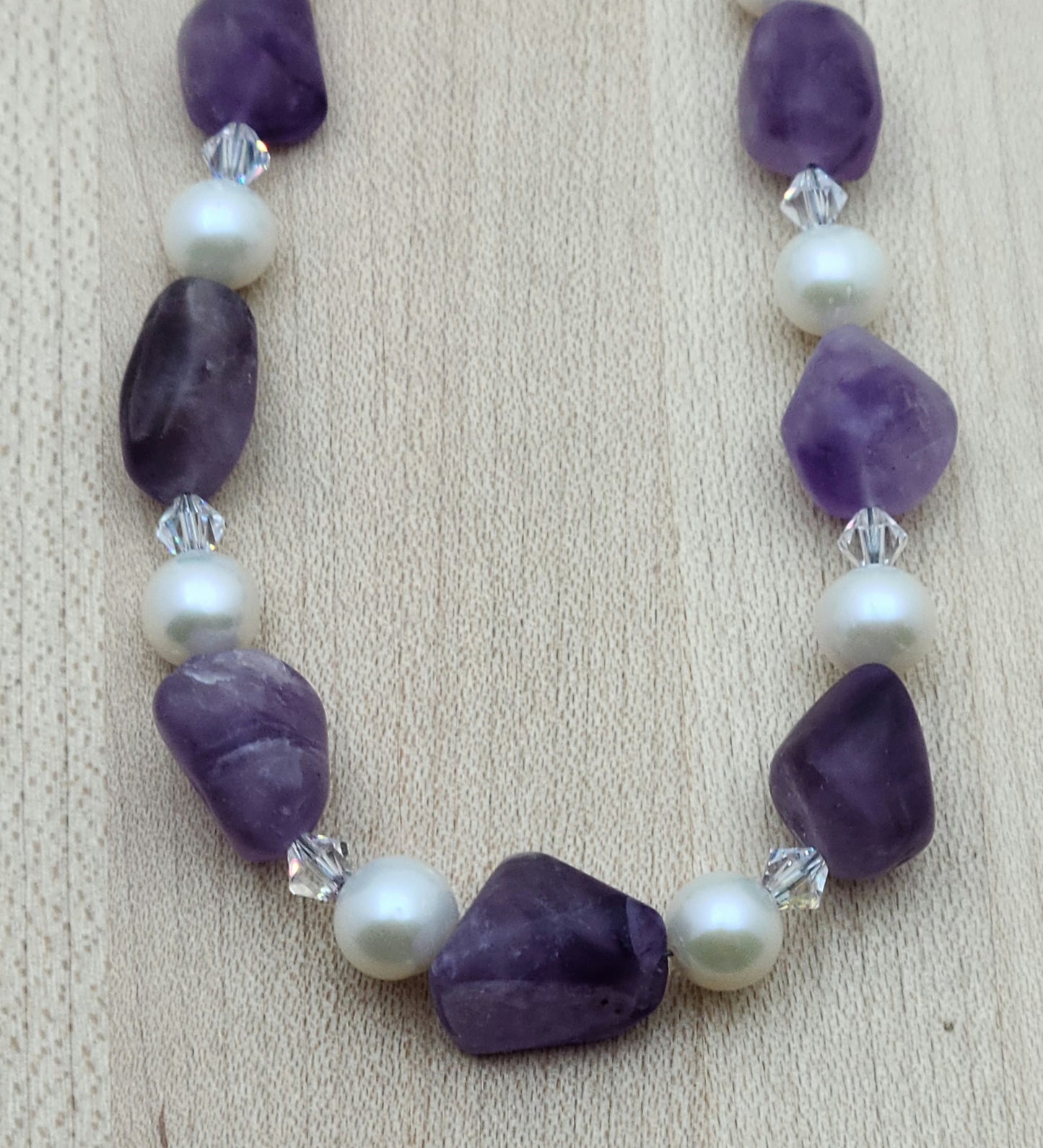 close up of Matte Amethyst, White FW Pearls, and Crystal Necklace