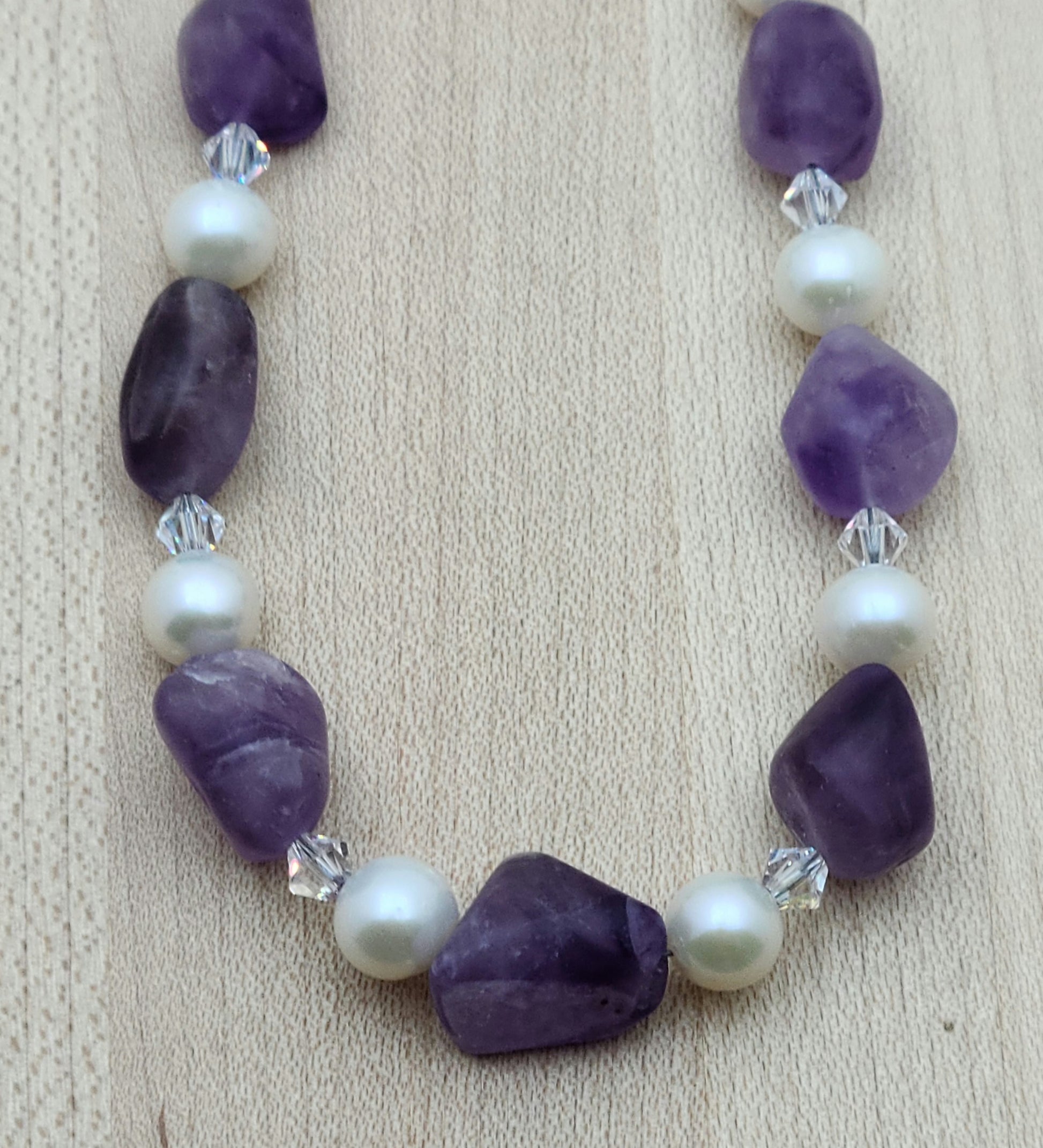 close up of Matte Amethyst, White FW Pearls, and Crystal Necklace