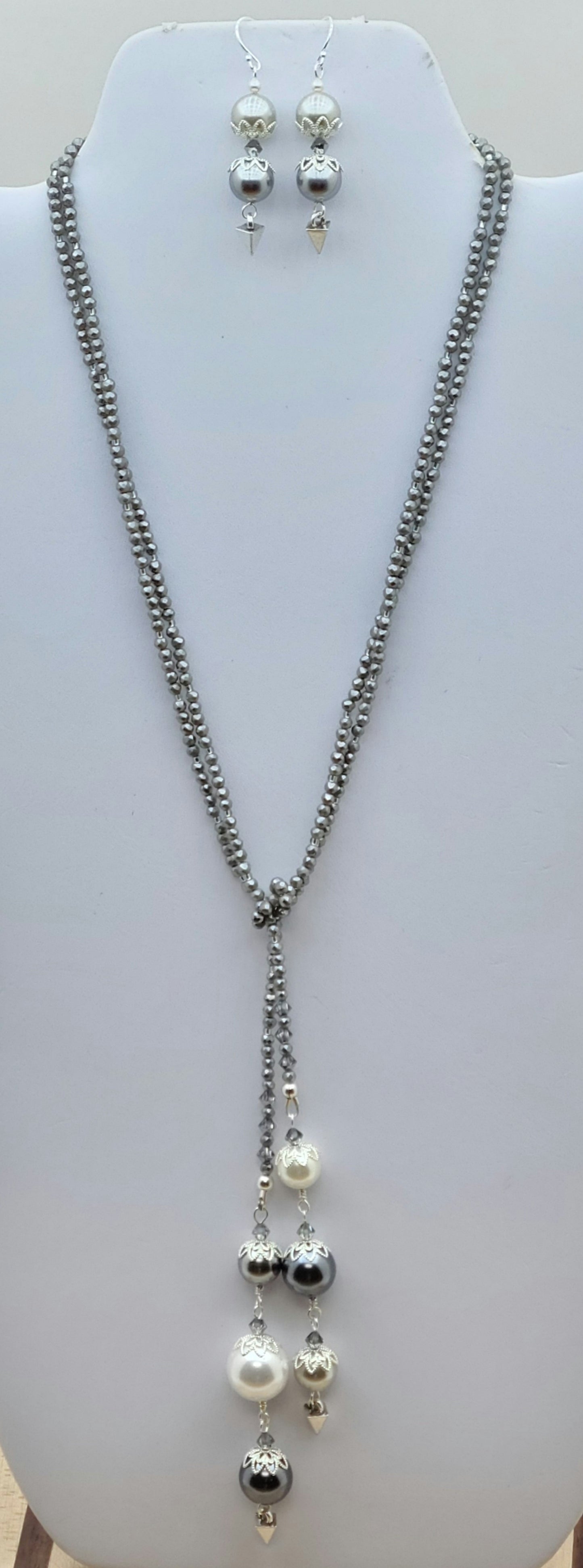 Elegant silver & white shell pearl lariat-style necklace measuring 48 inches — designed to wrap, drape, and layer for endless styling possibilities. Shell pearl earrings