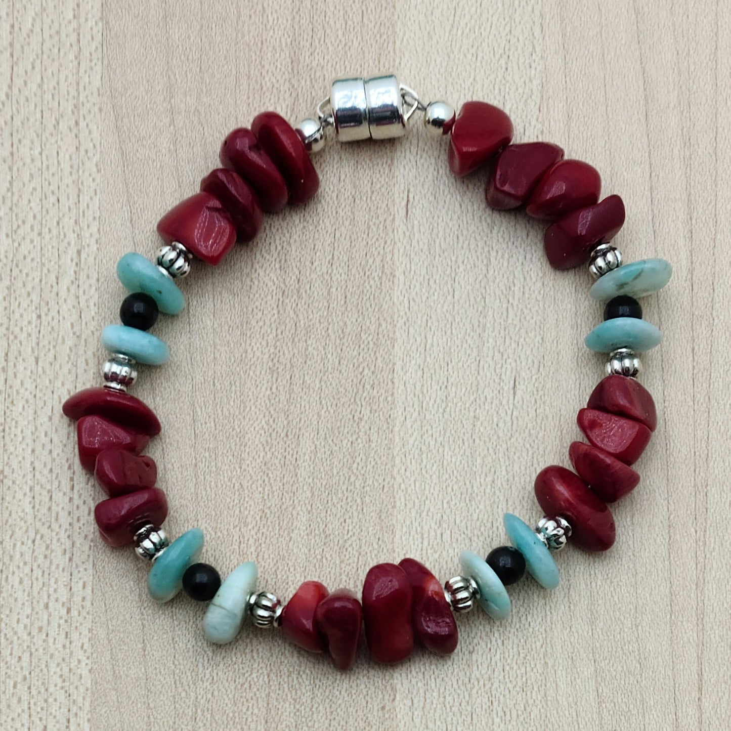 Bright colors, chunky stones! Nuggets of amazonite &; coral swing with black onyx & pewter beads for a wonderful, bold look in a  bracelet with a magnetic clasp.
