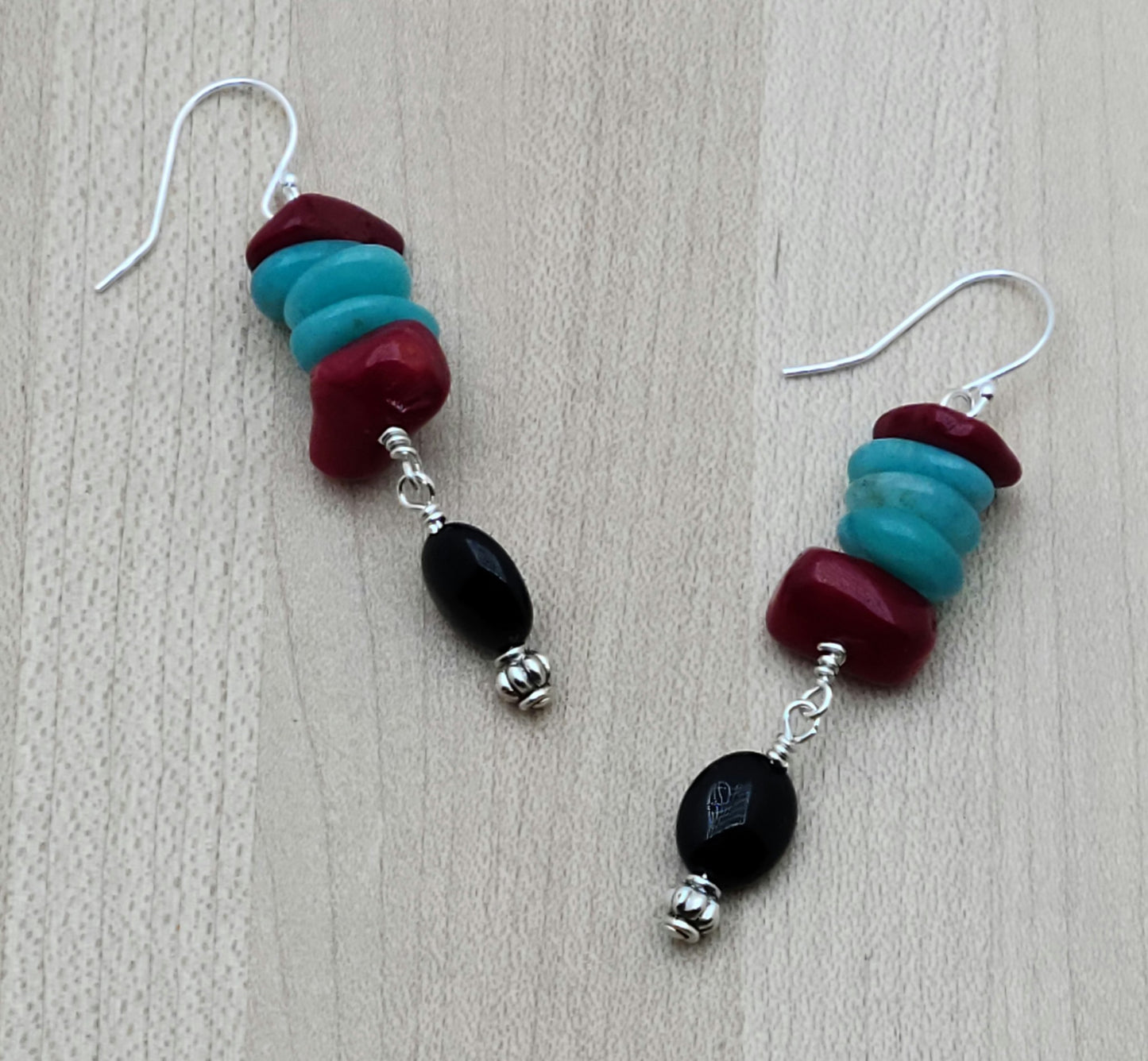 Bright colors, chunky stones! Nuggets of amazonite & coral swing with black onyx & pewter beads for a wonderful, bold look in these earrings.