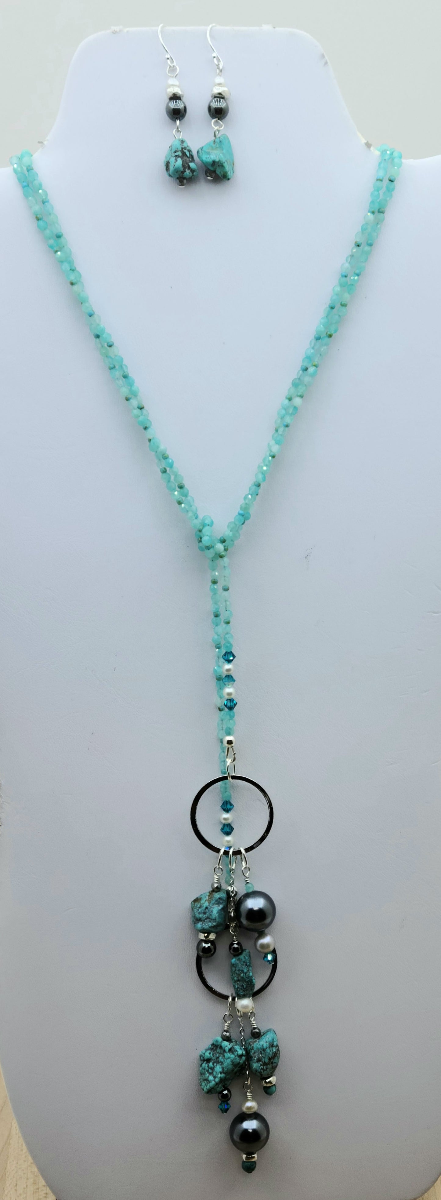 Lariat style necklace of shell pearls, fw pearls, hematite, crystals, turquoise, & amazonite. Turquoise nugget earrings.