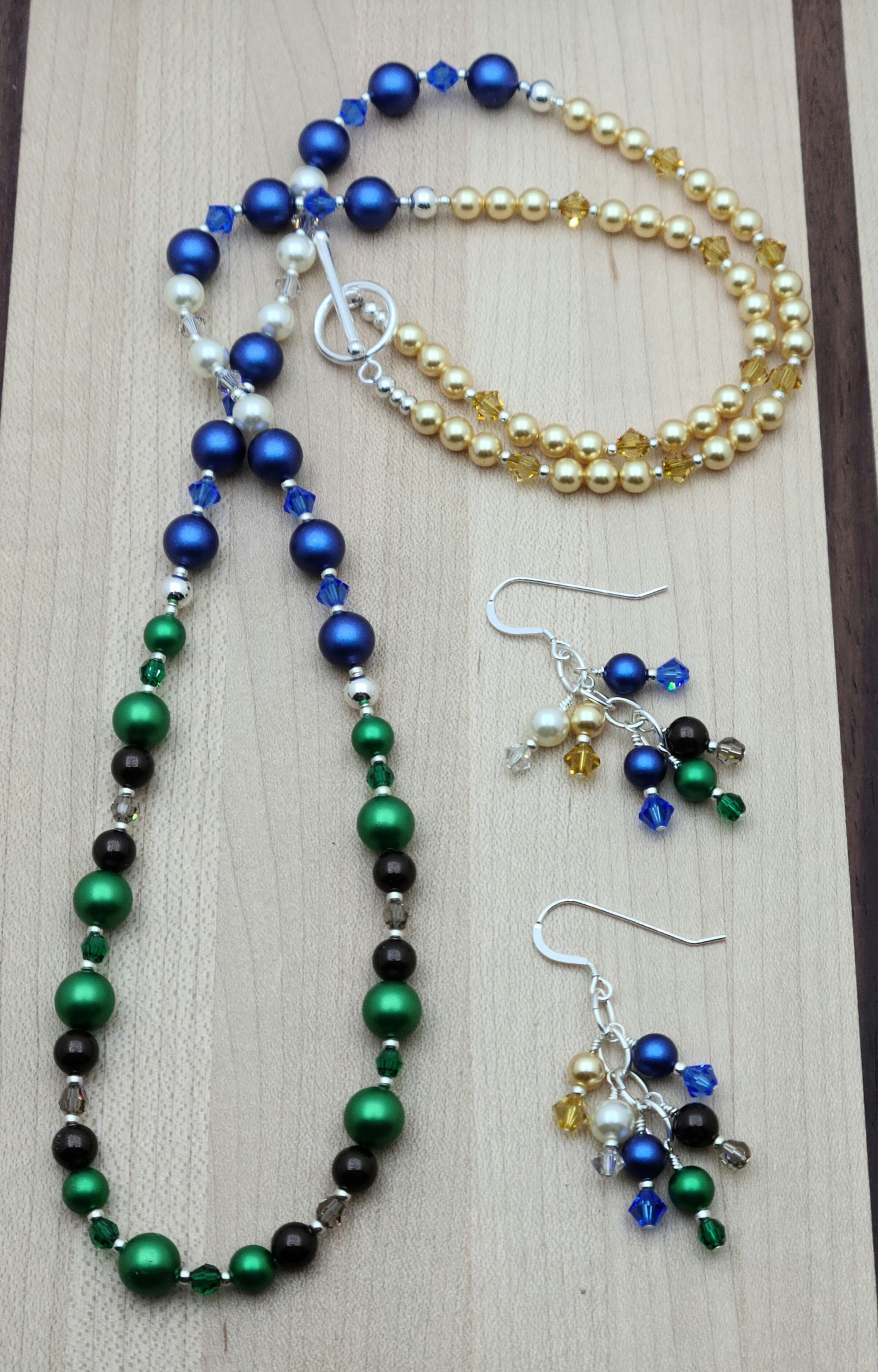 Nature lovers rejoice. This set has it all - earth, growth, water. clouds, sky, & sun! All represented by bright crystal pearls and crystals.