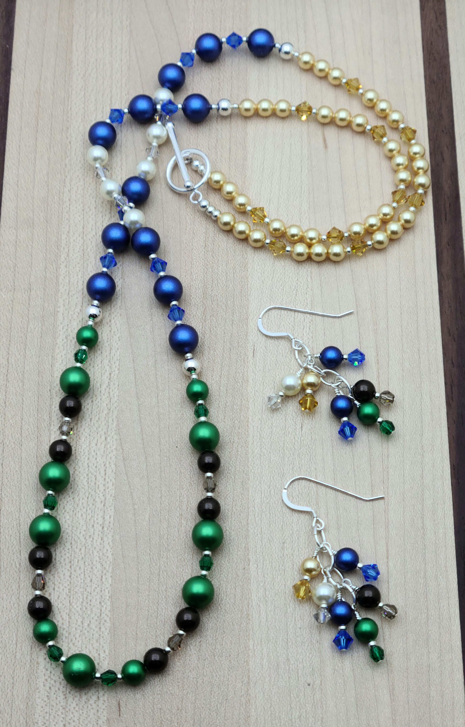 Nature lovers rejoice. This set has it all - earth, growth, water. clouds, sky, & sun! All represented by bright crystal pearls and crystals.