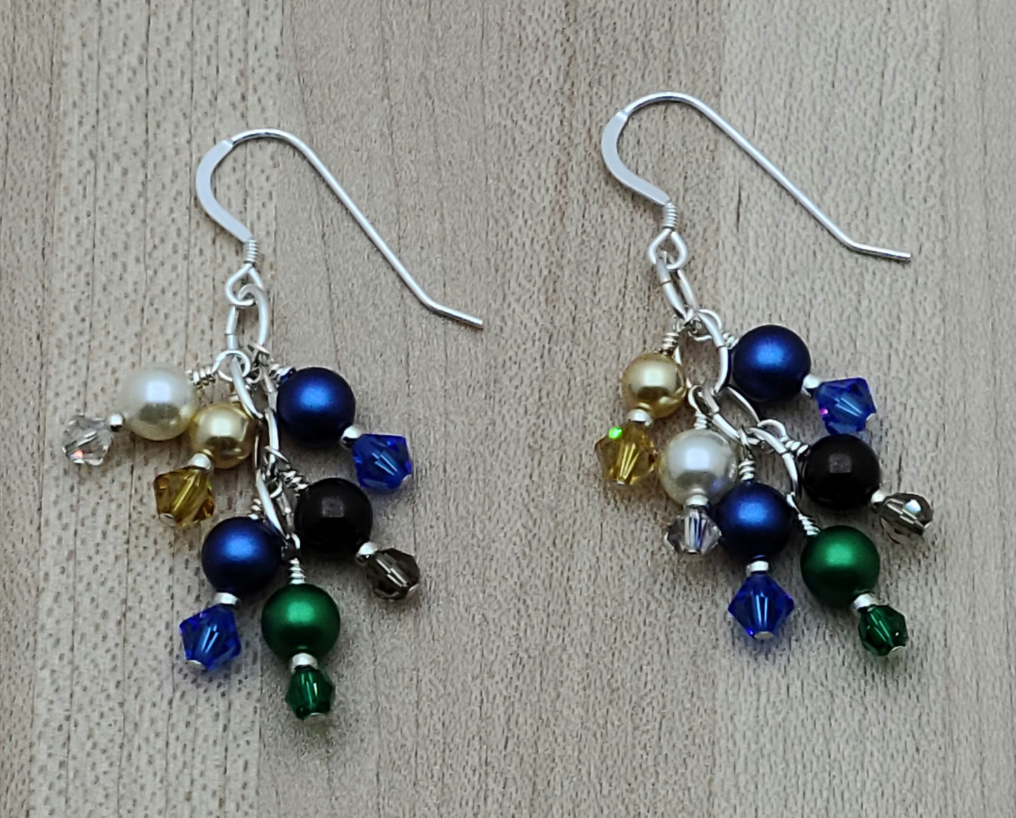 Nature lovers rejoice. These earrings  have it all - earth, growth, water. clouds, sky, & sun! All represented by bright crystal pearls and crystals.