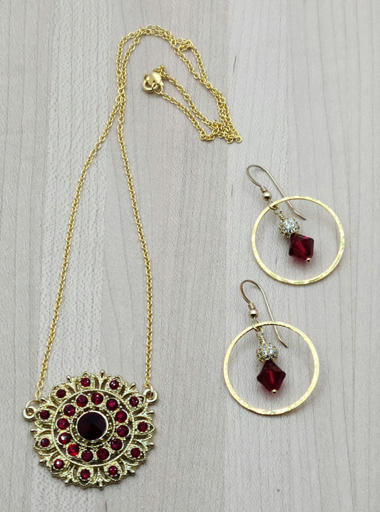 I found a gorgeous gold vintage scarlet crystal encrusted medallion, added chain and earrings, and voila - a very striking set!