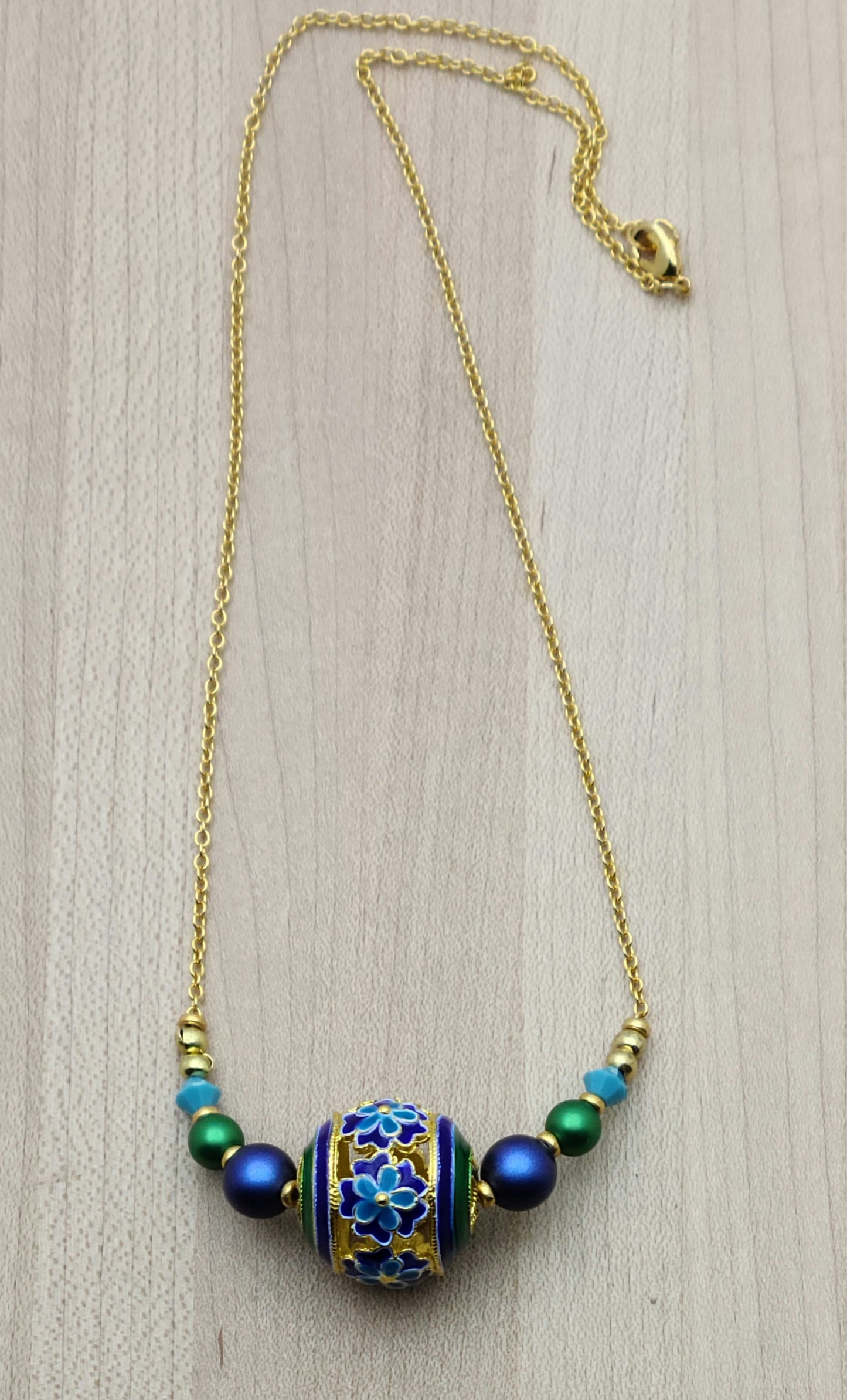 You'll smile every time you wear these vividly colored cloisonne beads of turquoise, blue, green, & gold! I've added equally bright & complimentary colors of crystal pearls and crystals for a lovely set.