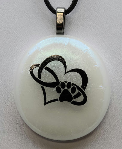 Show infinite love for your furry friend with the Heart Paw Fused Glass Pendant.