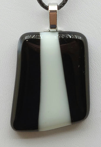 Add some playful pattern to your outfit with our Black with A White Stripe Fused Glass Pendant!