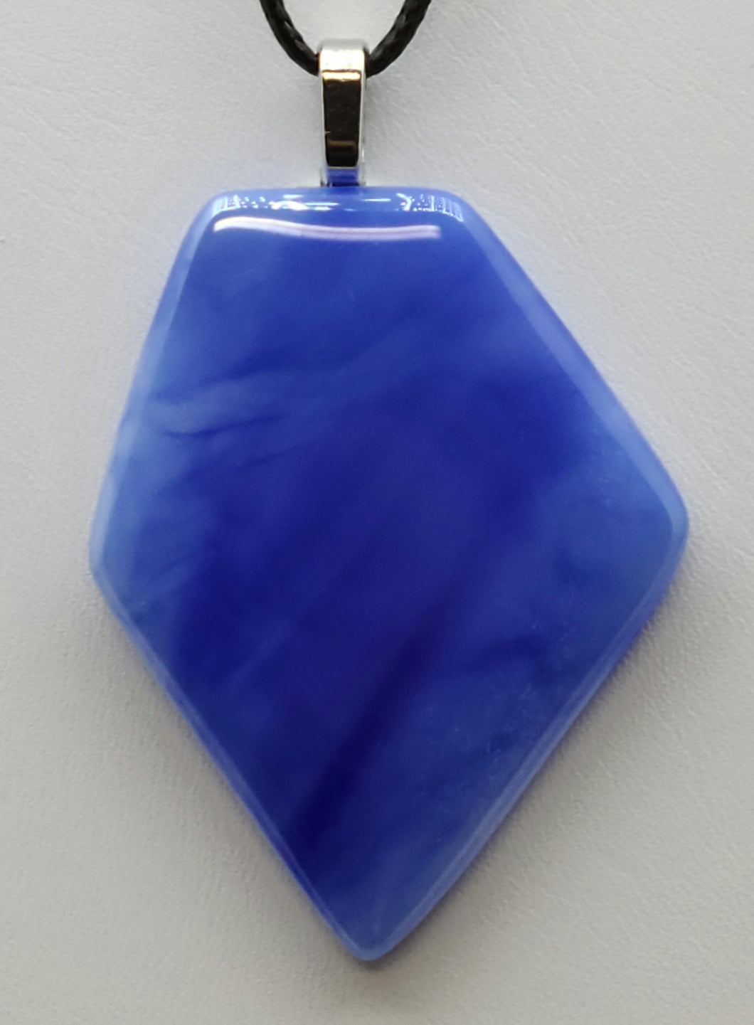 Add a touch of cool to your accessories with our Blue Ice Fused Glass Pendant.