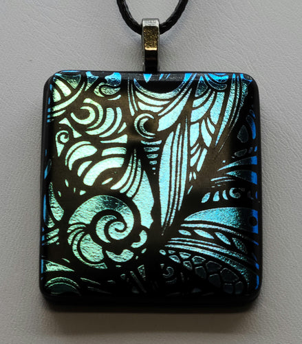 Experience the delicate beauty of our Blue Wings Fused Glass Pendant.