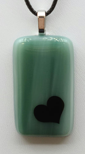 Add a pop of color and character to your outfit with our Heart on Cadet Blue Fused Glass Pendant!