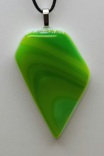 Add a fun twist to your outfit with our Olive Swirl Fused Glass Pendant. The playful mixture of olive green, spring green, and a hint of aqua will surely catch everyone's attention.