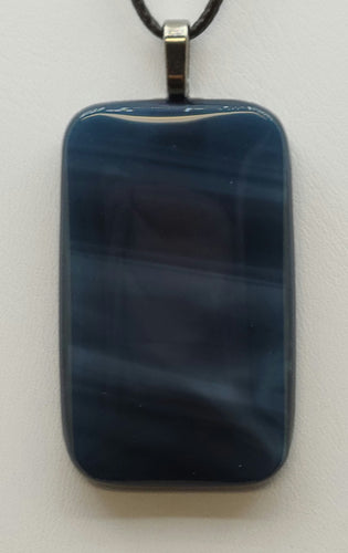 Experience the tranquil beauty of a new moon night with our Prussian Blue Fused Glass Pendant.