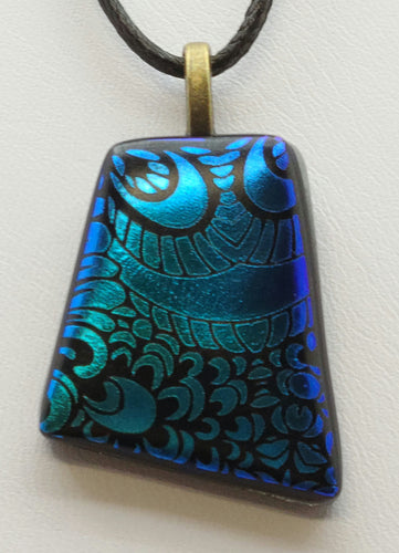 Enhance your outfit with our Small Blue Fused Glass Pendant. 