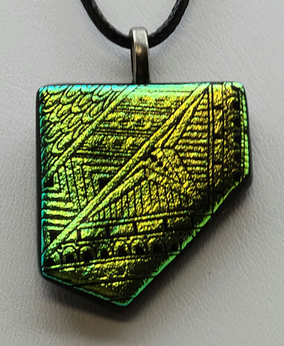 Add a pop of color (green/gold!) to your outfit with this striking fused glass pendant.