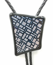 bolo tie of Silver & Black dichroic glass in an interesting geometric pattern backed by black glass