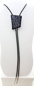 bolo tie of Silver & Black dichroic glass in an interesting geometric pattern backed by black glass