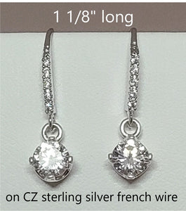 6mm stone four prong set in a dangle for sparkling movement and hung on a CZ set french wire 1 1/8"