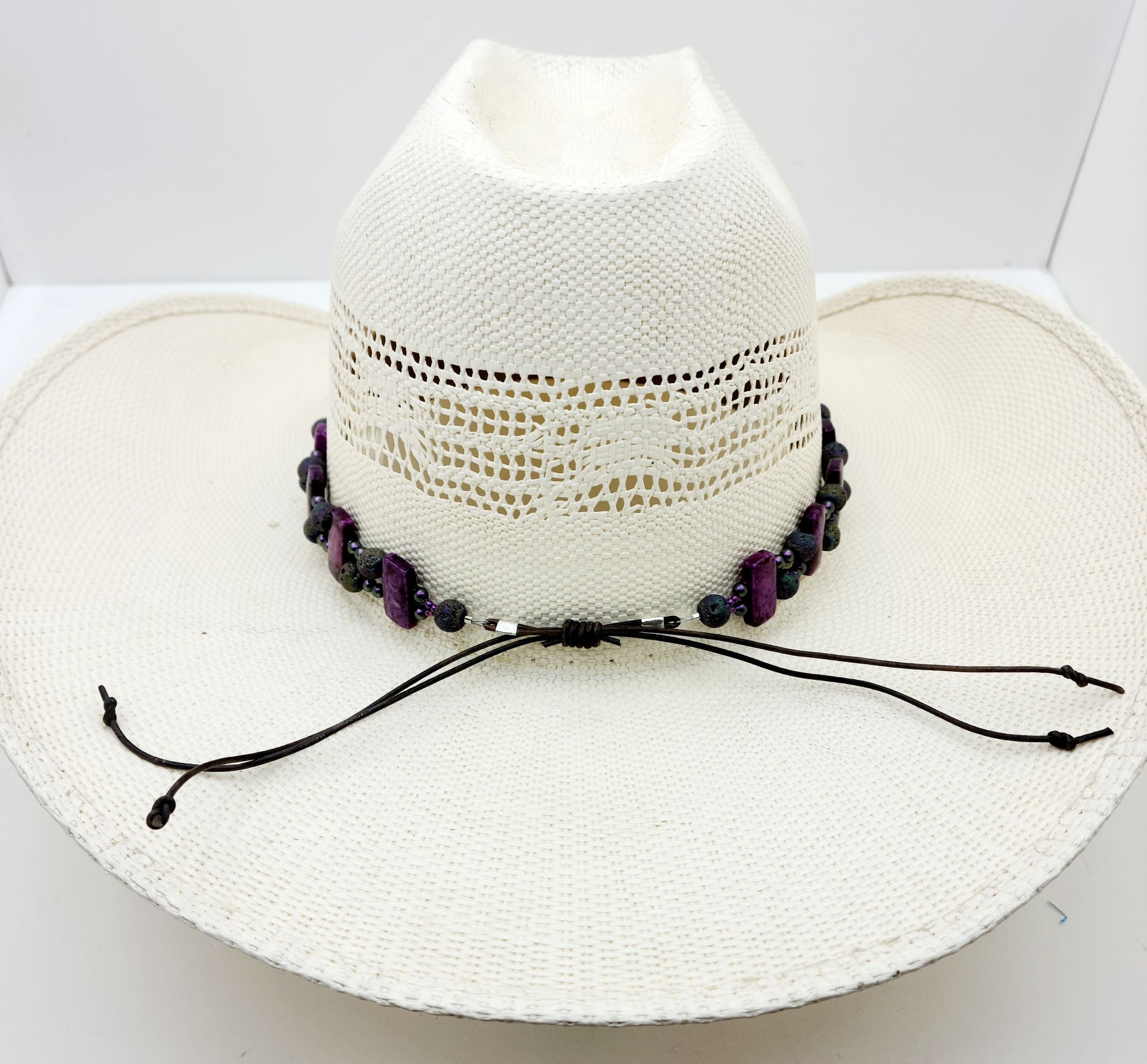 hatband combines deep purple crazy lace agate, iridescent lava stone, crystal pearls, Toho seed beads, sterling silver, & leather! Adjustable with a leather slider knot