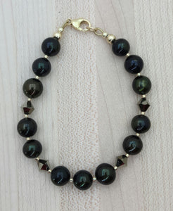 Very nice deep green pearls, aurum (latin for gold) crystals, champagne Miyuki delica, & gold filled findings bracelet