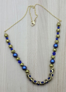 Ornate Gold Tube & Blue Crystal Necklace