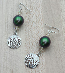 Iridescence is the highlight of these earrings  of scarab green crystal pearls & delicate light silk crystals