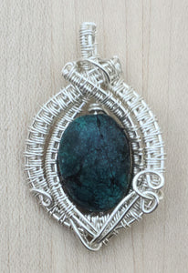 Silver woven wire framed turquoise nugget