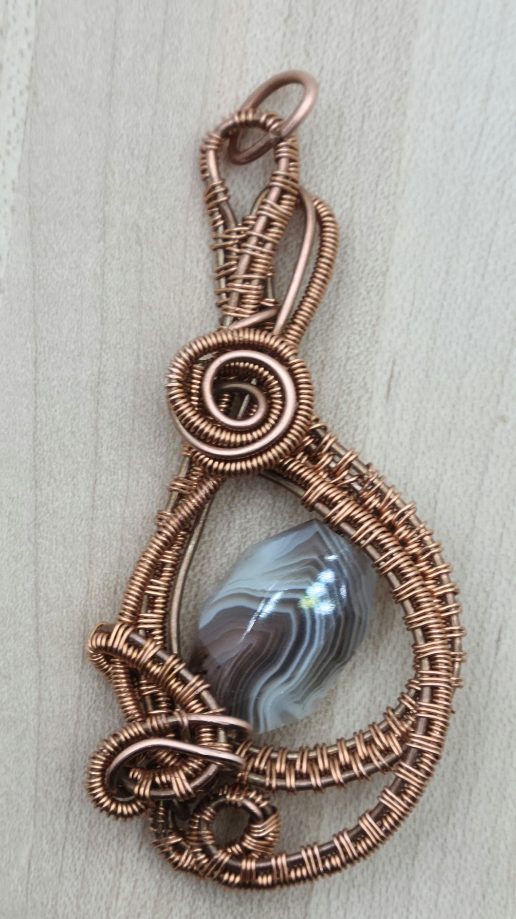 Woven wire framed botswana nugget pendant